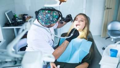 dentist curing female patient s teeth 23 2147862071