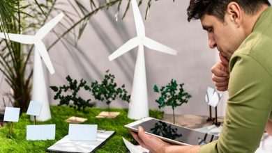 side view man using tablet eco friendly wind power project layout 23 2148847800