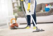 housewife clean carpet with vacuum