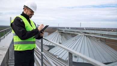 portrait construction worker standing rooftops high silos storage tanks working tablet computer 342744 441